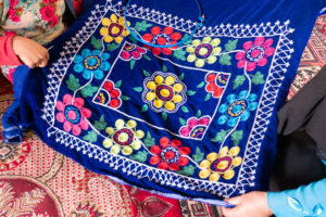 Beautiful embroidered cushion cover made by IDPs