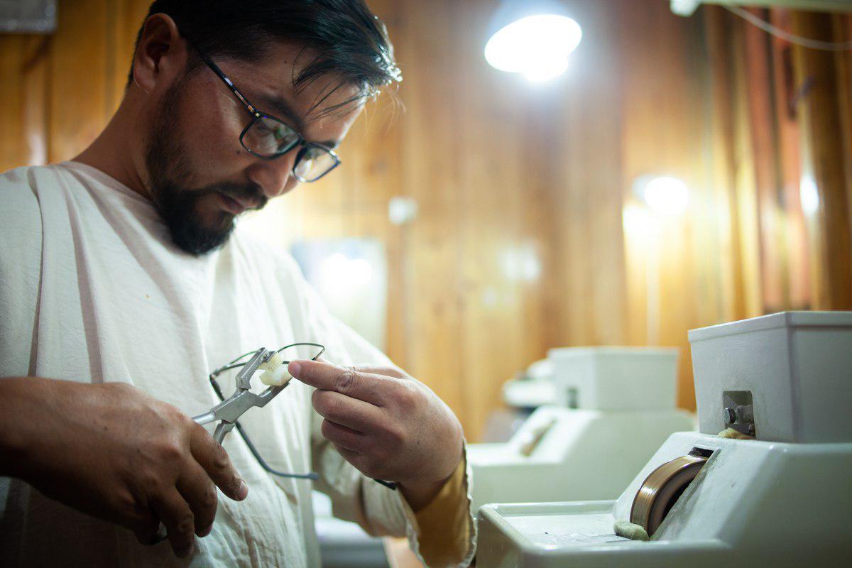 An optician making eye glasses 